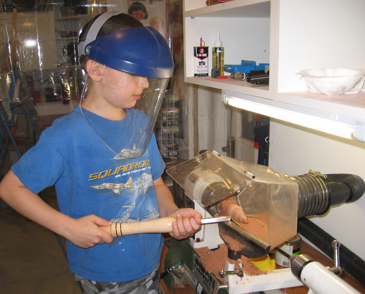 Sam at 10 testing a turning project for a class