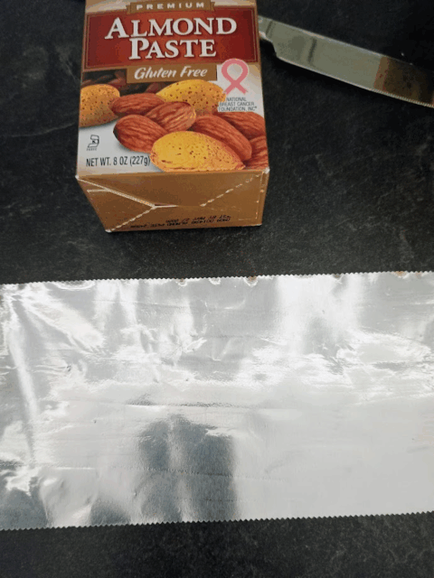 SOLO Almond Paste box used to burnish tinfoil smooth