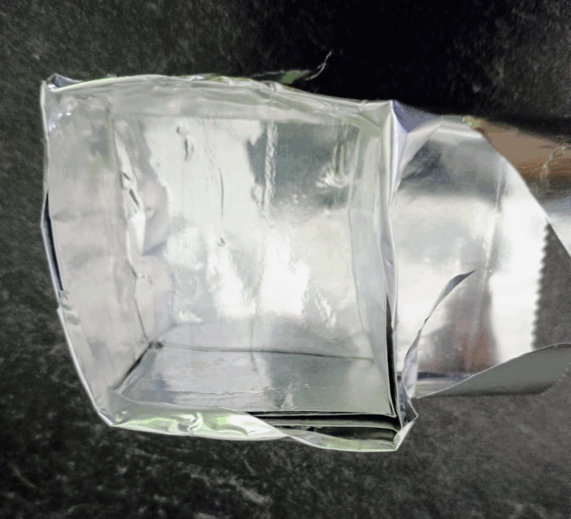 Tinfoil cube used to hold beads for baking